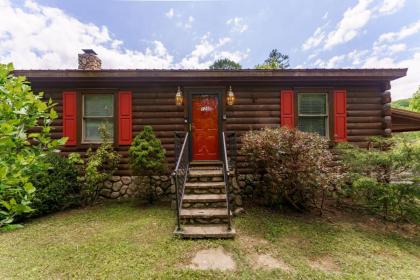 Greenbrier Woods Log Cabin with Hot Tub Stone Wood Fireplace Covered Deck and Close to Gatlinburg - image 1