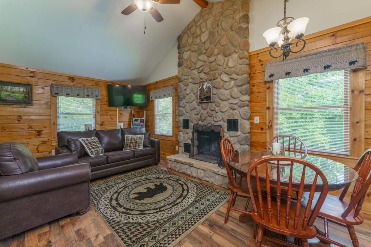 Greenbrier Woods Log Cabin with Hot Tub Stone Wood Fireplace Covered Deck and Close to Gatlinburg - image 5